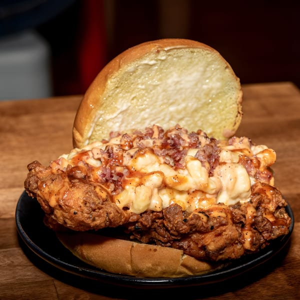 Fire Nashville Hot Chicken sandwich with fried chicken, mac and cheese, bacon, and sauce.